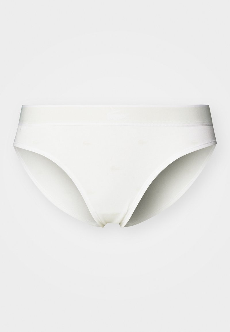 Slip in cotone bianco con un morbido elastico in vita. Presenta una texture liscia e un branding discreto. Design classico con una forma a copertura totale.