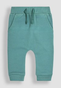 Türkise Baumwollshorts mit elastischem Bund, zwei Seitentaschen und gerippten Bündchen. Der Stoff hat eine glatte Oberfläche. Kordelzug ist enthalten.