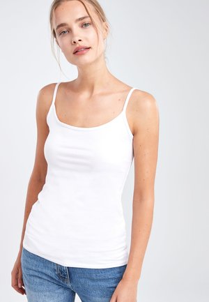 White, fitted tank top with thin straps, made of smooth cotton fabric. Features a rounded neckline and seam detailing along the sides.