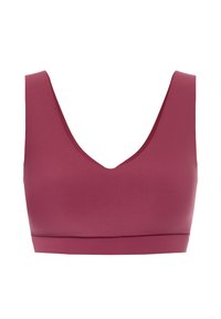Mauve sports bra with a deep V-neck, wide straps, and a smooth, stretchy fabric. Features a wide bottom band for support.