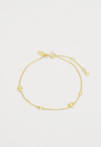 Pulseira em tom dourado com design de corrente ligada, apresentando pendentes texturizados em várias formas. Comprimento ajustável com fecho tipo lagosta.