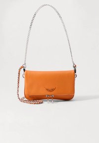 Orange leather crossbody bag with a textured surface, silver chain strap, and a decorative front accent. Compact rectangular shape.