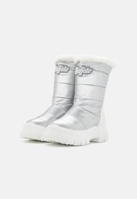 Silver, padded boots with a faux fur lining and a chunky, white rubber sole. Features a logo on the shaft and horizontal stitching detail.