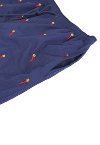 Pantaloni da bagno navy con vita elasticizzata e cordoncino, decorati con piccoli motivi di peperoncini rossi e gialli ricamati.