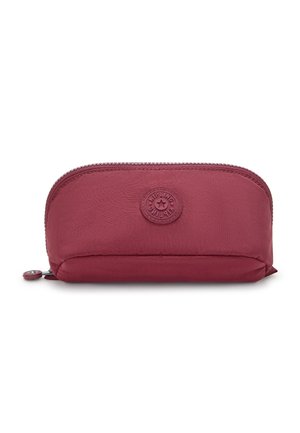 Burgunderfarbene Stofftasche mit abgerundeter Form, Reißverschluss und einem Logo-Patch auf der Vorderseite. Glatte Textur, kompakte Größe, geeignet für Accessoires.