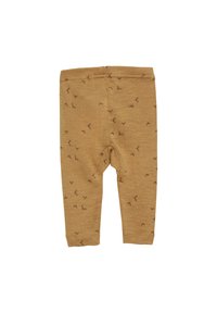 Lichtbruine leggings van zachte stof, met een subtiele print van kleine bruine patronen door het geheel. Elastische tailleband en een aansluitend ontwerp.