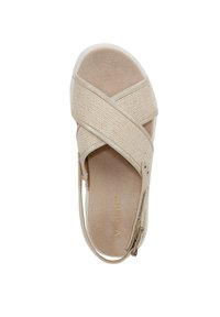 Beige sandal with crisscross fabric straps, textured surface, and a cushioned insole. Features a zipper for adjustable fit and a lightweight sole.