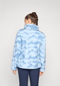 Light blue jacket with a cloud pattern, high collar, and long sleeves. Smooth texture, made from stretch fabric for comfort and movement.
