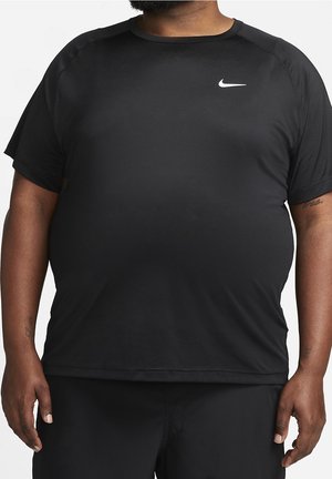 Plus-size person wearing a black short-sleeve Nike athletic shirt with white logo centered on chest.