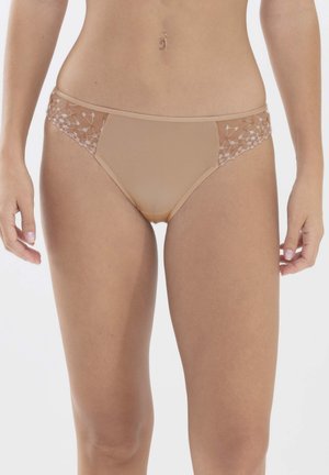 Beige underwear with floral lace detailing on the sides. The fabric is smooth, and the fit is low-rise with minimal coverage at the back.