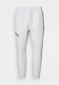 UNSTOPPABLE FLEECE - Träningsbyxor - summit white/black