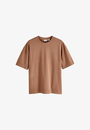 Ruda trumpa rankovė t-shirt, pagaminta iš minkštos medvilnės. Yra apvalios iškirptės ir laisvas kirpimas. Nėra matomų raštų ar grafikų.