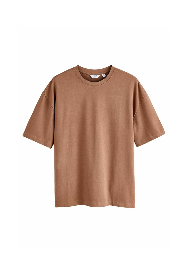 Ruda trumpa rankovė t-shirt, pagaminta iš minkštos medvilnės. Yra apvalios iškirptės ir laisvas kirpimas. Nėra matomų raštų ar grafikų.