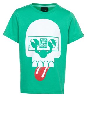Grøn T-shirt med korte ærmer med en hvid kraniegrafik, hvor DJ pladespillere fungerer som øjne og en rød tunge stikker ud.
