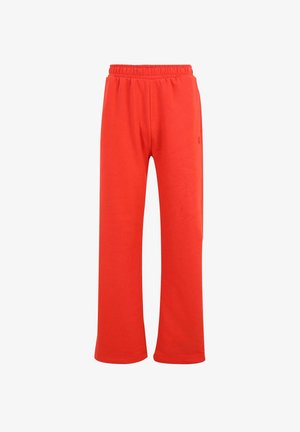 Pantalons de survêtement rouges avec une taille élastique, fabriqués en tissu doux, offrant une coupe décontractée et des jambes droites. Aucun motif ou accent visible.