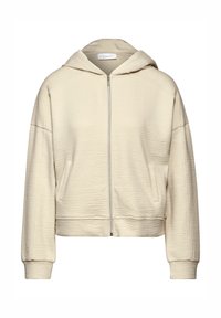 Sudadera de cremallera color crema con tejido texturizado, capucha y bolsillos laterales; cuenta con puños y dobladillo de canalé para un ajuste ceñido.