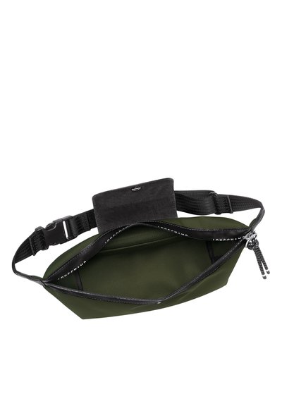 Grüne Stoff-Westentasche mit Reißverschluss, verstellbarem Riemen und einem schwarzen Wildlederpanel oben. Das Innere hat eine glatte Textur und keine sichtbaren Taschen.