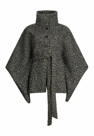 Poncho aus dunkelgrauer Wolle im Hahnentritt-Muster, mit hohem Kragen, Knopfverschluss und gebundenem Taillengürtel. Auffällige strukturierte Oberfläche.