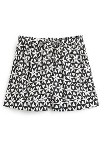 Shorts à motifs en noir et blanc avec taille élastique et cordon de serrage, présentant des formes géométriques abstraites et des poches latérales.