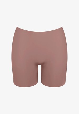 Shorts modellanti senza cuciture a vita alta color nudo, progettati per levigare fianchi e cosce, con lunghezza a metà coscia e senza cuciture visibili.