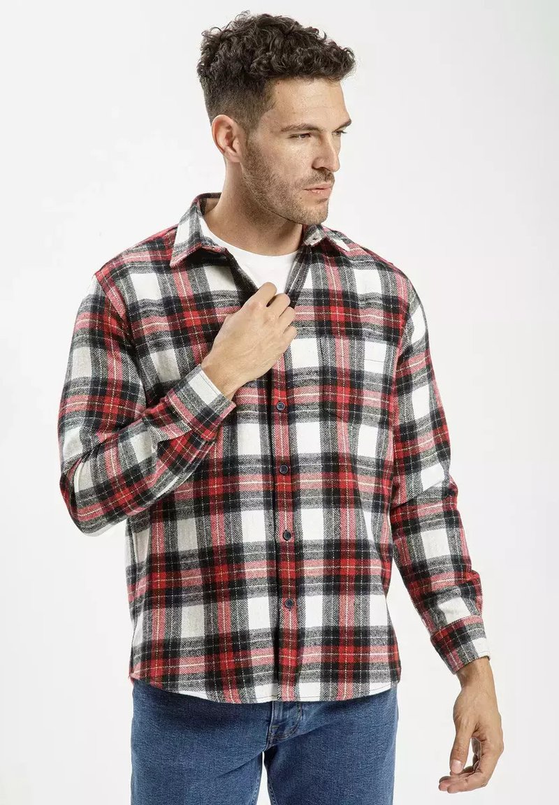 Czerwono-czarny i biały w kratkę flanelowy shirt z długimi rękawami, z przodu zapinany na guziki, z kołnierzykiem. Miękka struktura z wyraźnym wzorem w kratkę.