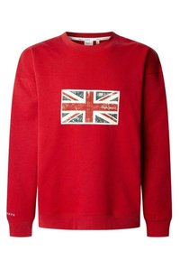 Sudadera roja con un gráfico de la bandera británica con borde blanco en la parte frontal. Cuenta con puños y dobladillo acanalados, con "1979" impreso en la manga.