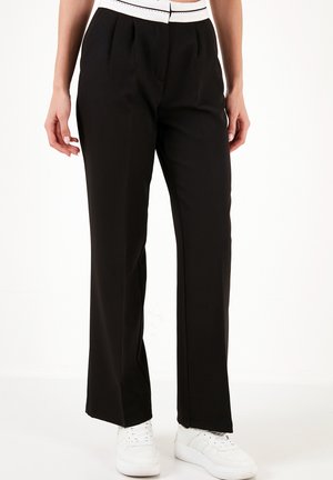 REGULAR FIT - Trousers - black