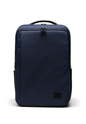 Navy blue backpack made of durable fabric, featuring a sleek rectangular design, top handle, and two side pockets. Contains zipper closure.