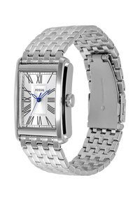 Montre-bracelet Fossil rectangulaire argentée avec aiguilles bleues, cadran à chiffres romains et bracelet à maillons en acier inoxydable avec fermoir déployant.