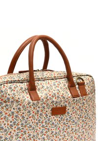 Blumenmuster-Tasche mit einem cremefarbigen Hintergrund und orangefarbenen, lila und grünen Akzenten. Braune Ledergriffe und -riemen sorgen für Langlebigkeit.