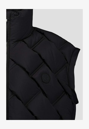 Zwarte gewatteerde jas mouw met horizontale stiksels en een zwart rond JOTT-logo patch, weergegeven tegen een lichtgrijze achtergrond.