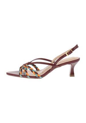 Brown leather heeled sandal with slingback strap, gold buckle, and braided multicolored orange, teal, and brown straps over the toe.