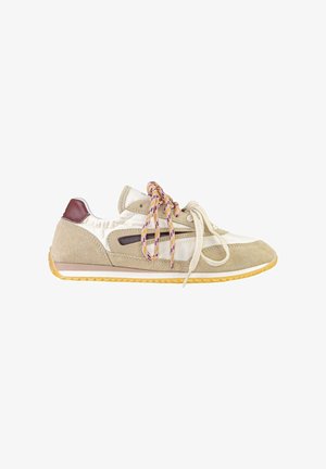 Beige and white suede sneaker with gum sole, two sets of laces—one pink patterned, one plain cream—side stripe detail, and burgundy heel patch.