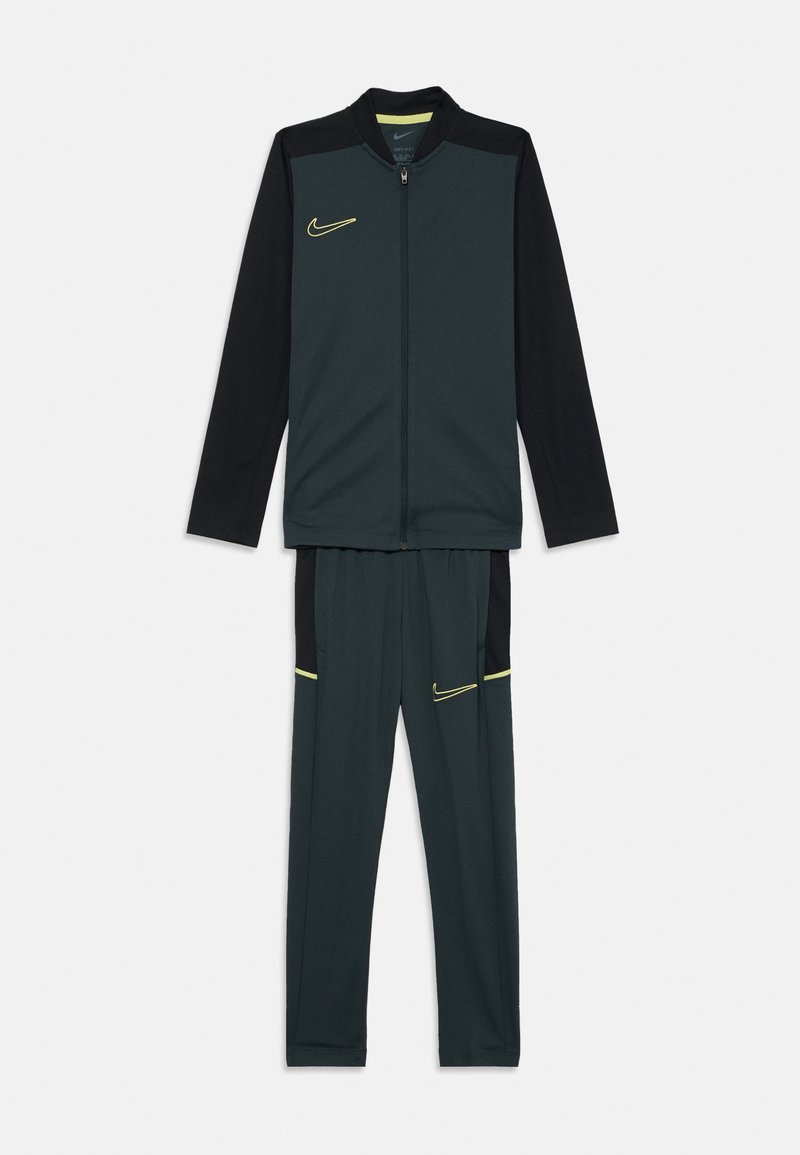 Nike tracksuit featuring a dark green zip-up jacket with black sleeves and yellow accents, paired with matching dark green pants with side pockets.