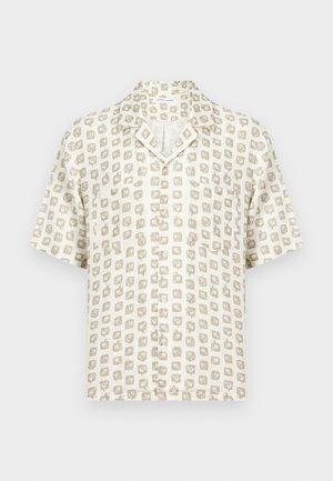 Chemise à manches courtes avec un motif abstrait de carrés beige et blanc et une petite poche poitrine.