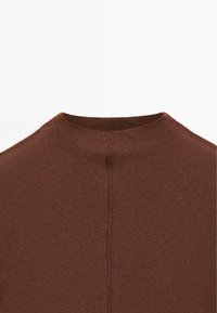 Brown knitted top featuring a high neckline, ribbed texture, and a central seam on the back. Material appears soft and flexible.