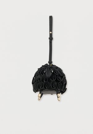 Black leather handbag with rounded shape, featuring layered, circular embellishments and a detachable strap. Gold hardware accents noted.