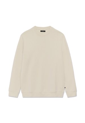 Bēšs džemperis ar apaļu kakla izgriezumu un garām piedurknēm, izgatavots no mīksta auduma. Tam ir ribots apkakle un aproces, kā arī neliela logotipa birka pie apakšas.