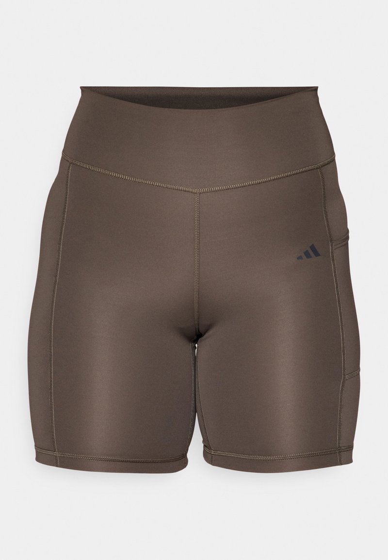 Pantalones cortos deportivos marrones con una textura suave, cinturilla alta y costuras oscuras contrastantes. Presenta un pequeño logotipo negro en el lado izquierdo.