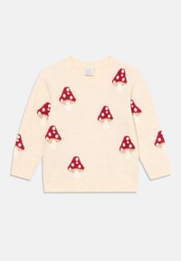 Kræmfarvet sweater med røde og hvide prikkede svampe mønstre spredt over forsiden og ærmerne.