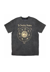 Black t-shirt featuring a circular sun graphic with a face, surrounded by astrological symbols in gold. Short sleeves and crew neck design.