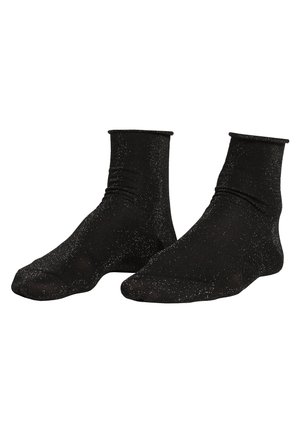 Czarne skarpetki do kostek z teksturowanym wzorem i srebrnymi kropkami w całym wzorze. Posiadają ściślejszy mankiet i bezszwowy design palców.