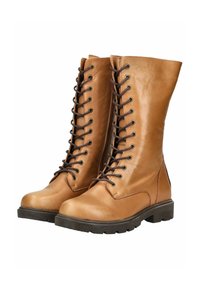 Tan leren laarzen tot de knie met een vetersluiting aan de voorkant, ronde neus en rubberen zool. Voorzien van metalen oogjes en een gladde afwerking.