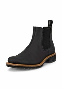 Las botas de tobillo de cuero negro cuentan con paneles laterales elásticos y una lengüeta. La suela tiene textura con un agarre de goma y un ribete marrón en contraste.