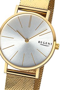 Montre dorée avec un cadran argenté en dégradé, indicateurs d'heure minimalistes et un bracelet en mailles dorées à motif. Nom de la marque "REGENT" affiché.