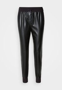 Black faux leather joggers with an elastic waistband and drawstring. Tapered leg design with ribbed ankle cuffs. Smooth texture.