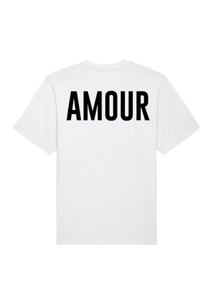 T-shirt en coton blanc avec un imprimé noir audacieux "AMOUR" au dos. Manches courtes et design classique à col rond.