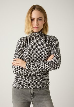 Langärmliges Oberteil mit hohem Kragen, das ein schwarz-weißes geometrisches Muster zeigt. Hergestellt aus einem weichen, elastischen Stoff; schmal geschnittenes Design.