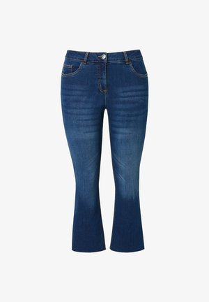 Jeans de denim azul oscuro con un ajuste slim, dobladillo acampanado y un ligero desgaste en los muslos. Cuenta con cinco bolsillos y un cierre frontal con botón.