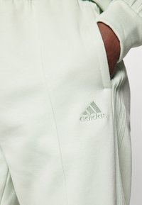 adidas Sportswear ENERGIZE - Tracksuit - linen green
